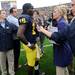 Michigan sophomore quarterback Denard Robinson speaks with the media on the field after Michigan's 42-37 win against Massachusetts at Michigan Stadium on Saturday. Melanie Maxwell I AnnArbor.com